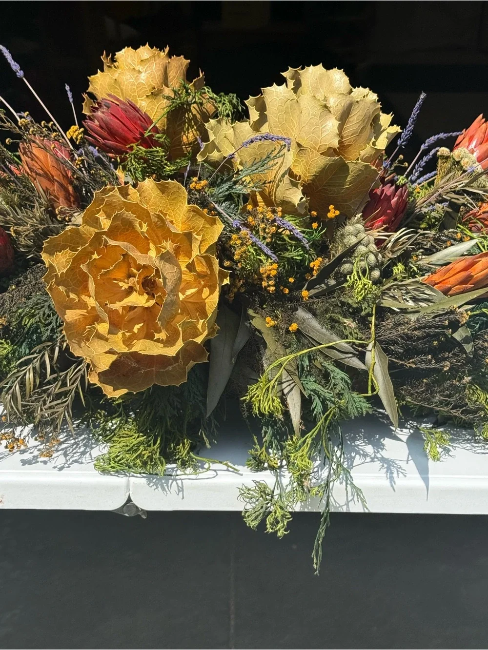 Autumn table center piece or decoration floral leaves full in planter box